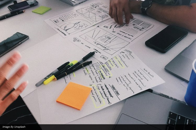 Ayanex design team evaluating a website for common web design mistakes to avoid during a UI/UX audit.