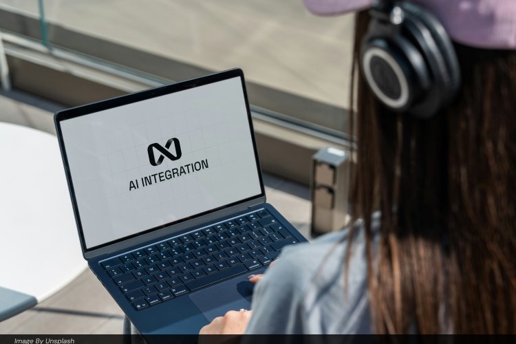 Person viewing a laptop screen displaying an "AI Integration" title screen